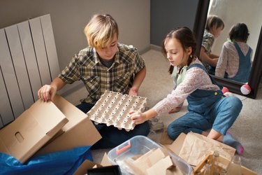 Family  sorting out waste for recycling