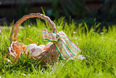 Easter egg hunt, basket in garden
