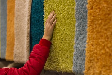 Plush carpets hanging side by side in a store