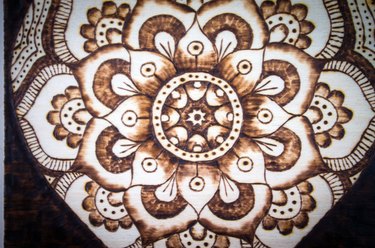 the ancient art of pyrography, wood and fire, mandala, the tranquility of life and soul