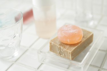 Close-up of two bars of soap in a soap dish
