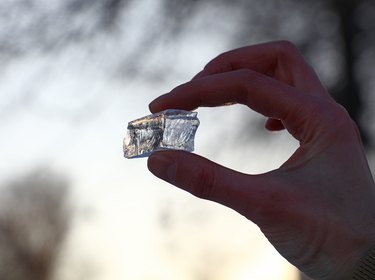 Woman holding ice cube