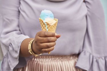 Closeup of woman holding an ice cream cone