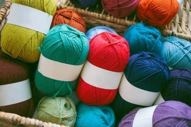 Colorful Skeins of Wool Yarn in Basket