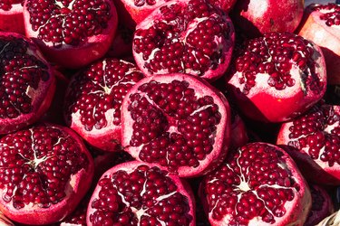 Ripe red pomegranates with cut-off tops