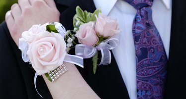 Hands of date Prom night flowers corsage formal wear