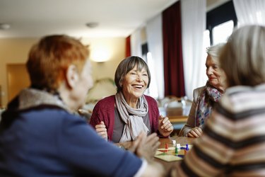 Senior Women Playing Board Game