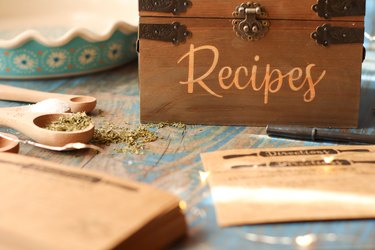 Vintage wooden recipe box with recipe cards in rustic kitchen