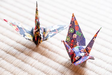 Japanese style origami cranes on tatami