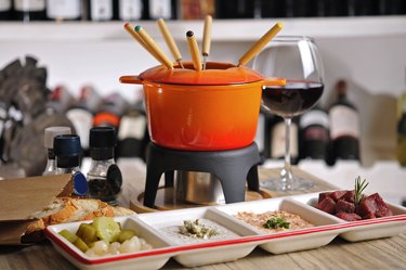 Fondue with appetizers and red wine