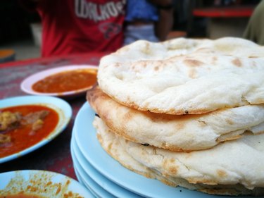 Roti Tempayan With Various Gravies, A Local Delicacy In Kuala Terengganu.