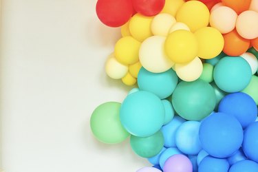 A rainbow coloured collection of balloons