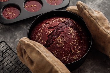 Freshly baked red velvet cake taken out from the oven