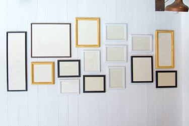 Classic frame on white cement wall in showroom and gallery.