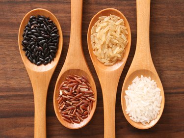 Different types of rice in spoons