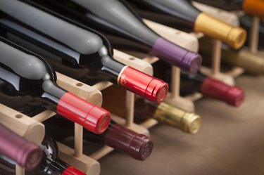 Red wine bottles on wine rack
