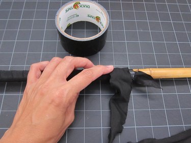 Wrapping the rod with black ribbon
