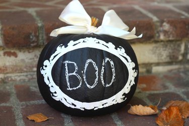 Write messages on the chalkboard pumpkin