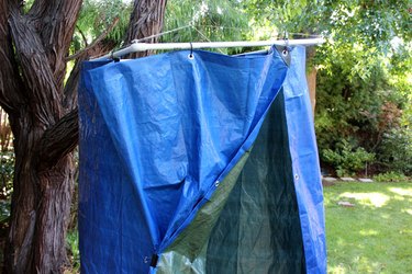 Hang the tarp on the PVC pipe