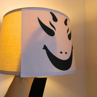 Adding the face inside the lampshade completes this simple home decor