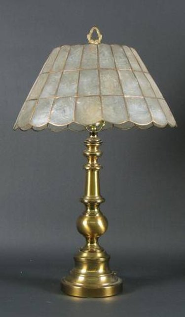 How do I clean a very old, solid brass lamp that is absolutely