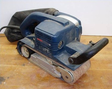 Sanding floor with outlet hand belt sander