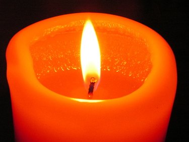 To make your candle burn cleaner and last longer