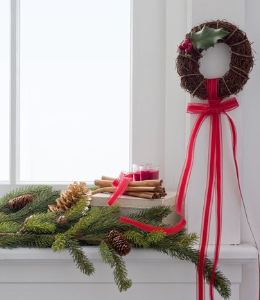 Christmas wreath and boughs on window sill