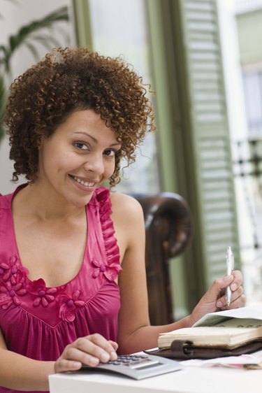 Smiling woman with paperwork