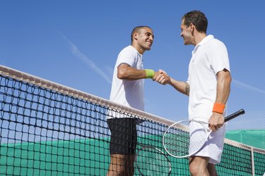 Men shaking hands after tennis