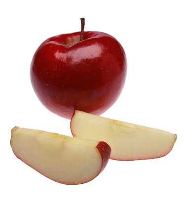 Whole apple and two slices