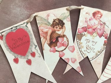 A garland made with vintage Valentine's Day cards and ribbon