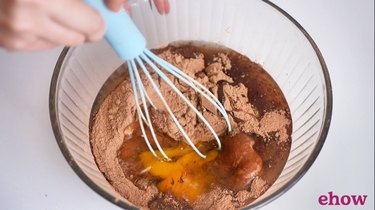 mixing chocolate cupcake batter