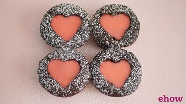 chocolate cupcakes with heart-shaped pink ganache center