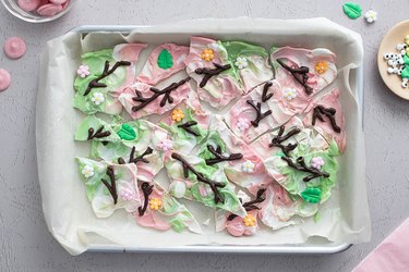 Marbled candy bark with chocolate twigs and icing decorations