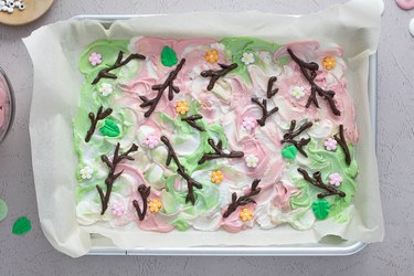 Marbled candy bark with chocolate twigs and icing decorations