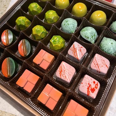 Pastel-colored assorted truffles in various shapes