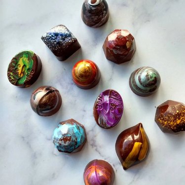 12 assorted truffles painted with bright colors