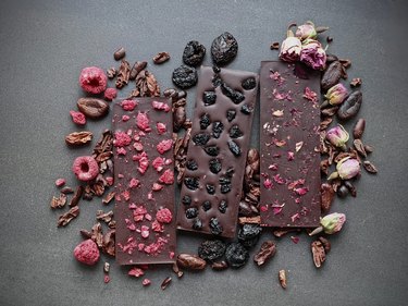 Three chocolate bars made with dried fruit and flower petals