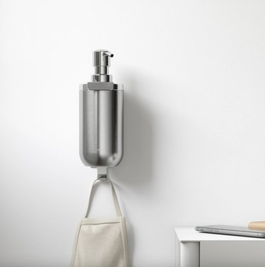 Wall mounted soap dispenser