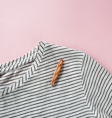Baguette brooch on striped shirt