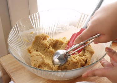 Scooping the mixing cookie dough