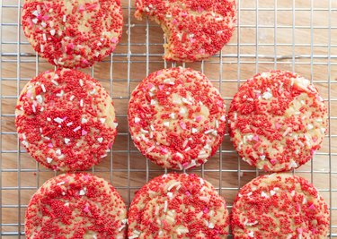 Valentine's Day sprinkle cookies on a wire rack