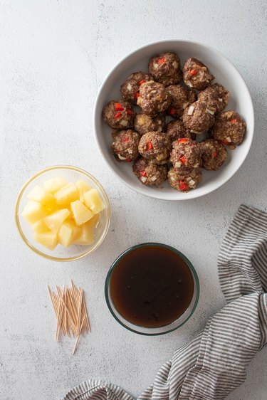 Ingredients for Hawaiian meatballs, including pineapple sauce