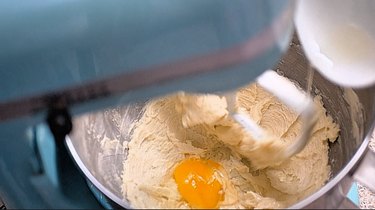 Cookie dough with egg ready to blend in