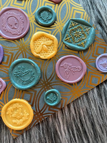 Turquoise, yellow, purple and mauve wax seal stickers