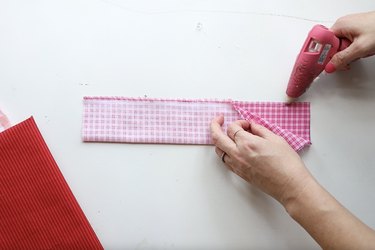 Gluing the seam of folded fabric closed