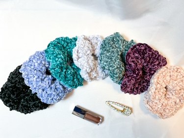 scrunchies in black, dusty blue, jade, frost blue, frost pine, eggplant and blush