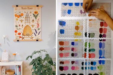 A puzzle hanging on the wall and a person taking apart a finished puzzle in large sections to store away