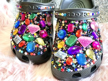 Black crocs heavily embellished with gems and charms